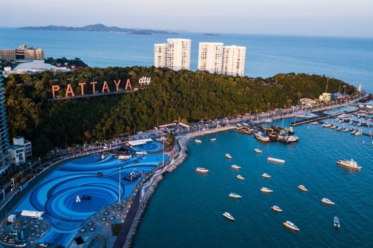 Pattaya beach bustling with tourists enjoying water sports