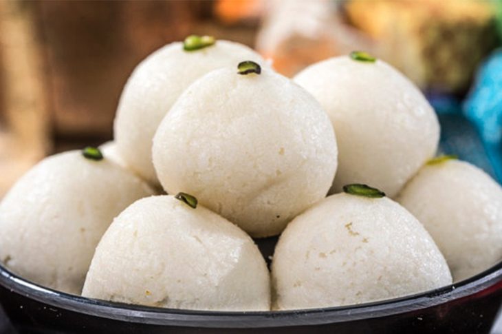 Close-up of soft, spongy Rasagola dripping with syrup